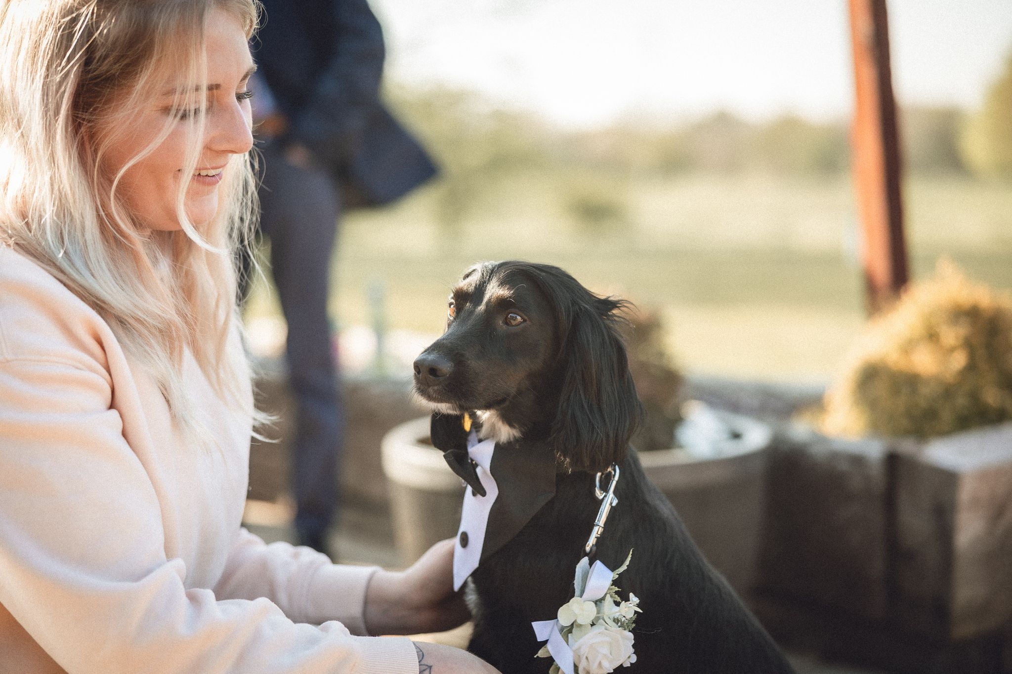 Bride and groom celebrating with their dog during a Waggy Wedding ceremony at Shenstone Golf Club, Aston Wood, UK, 2025.